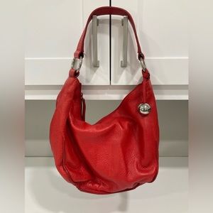 Red leather Furla handbag with silver hardware.